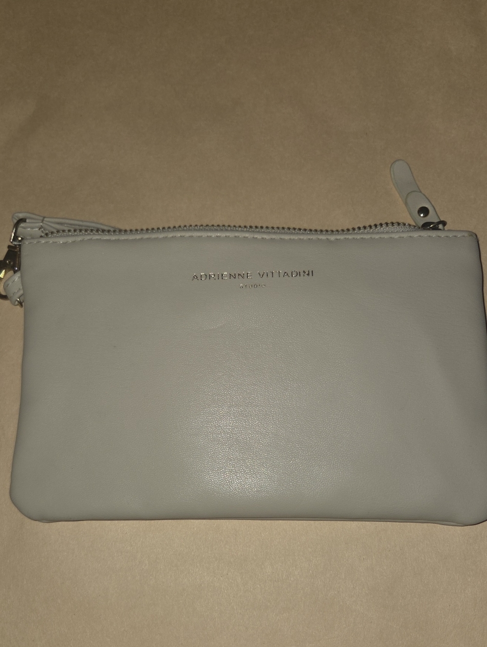 Adrienne Vittadini cream leather wristlet pouch